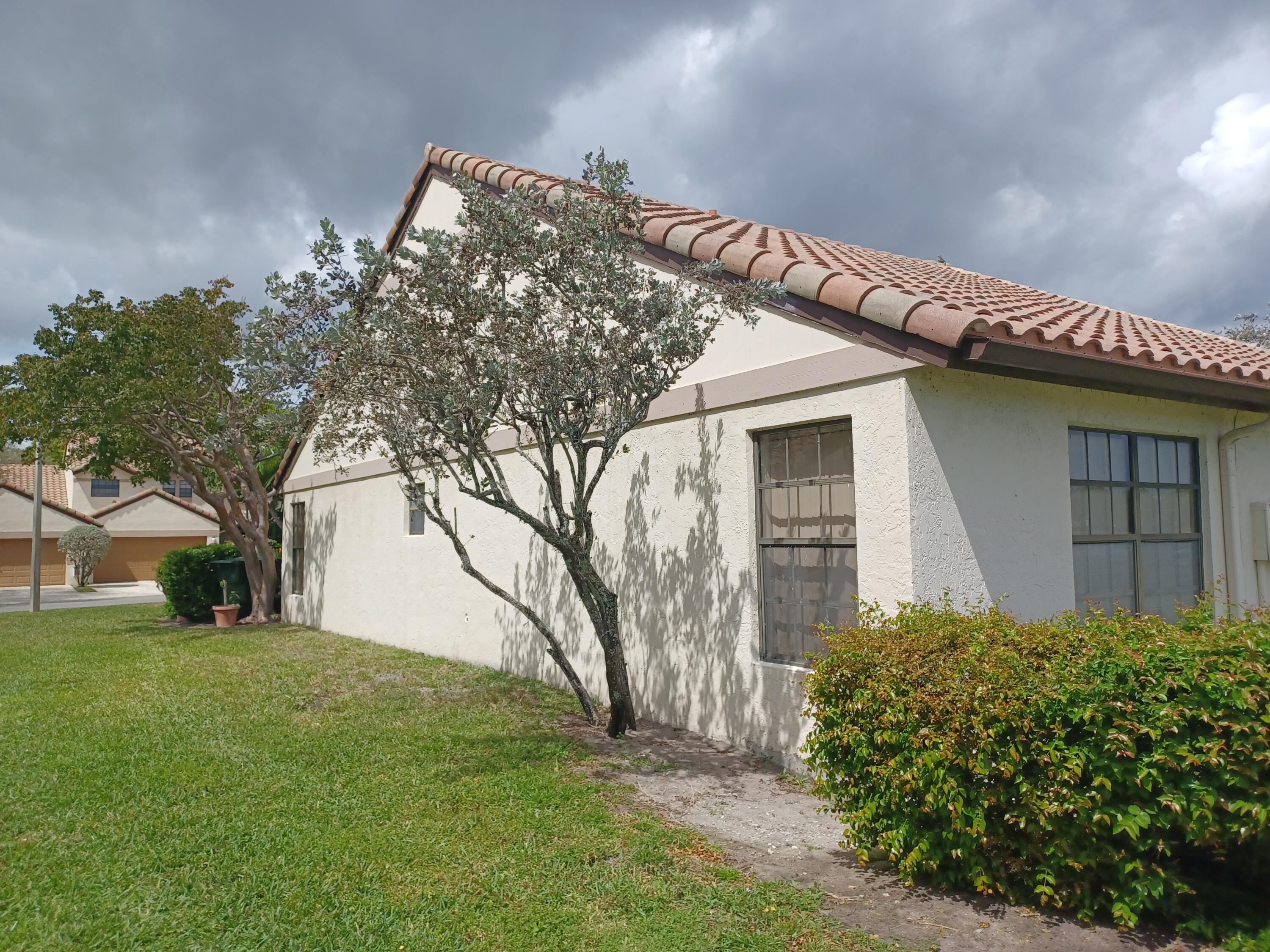 338 Eastwood Terrace Boca Raton, FL 33431 - Photo 5 of 31 a view of a house with a yard