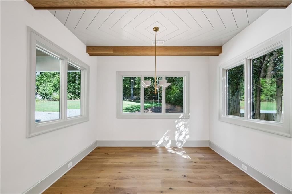 3756 Donaldson Drive Atlanta, GA 30341 - Photo 11 of 38 a view of an empty room with wooden floor and a window