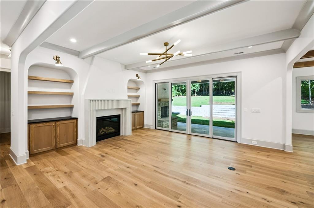 3756 Donaldson Drive Atlanta, GA 30341 - Photo 12 of 38 a view of an empty room with a fireplace and a window