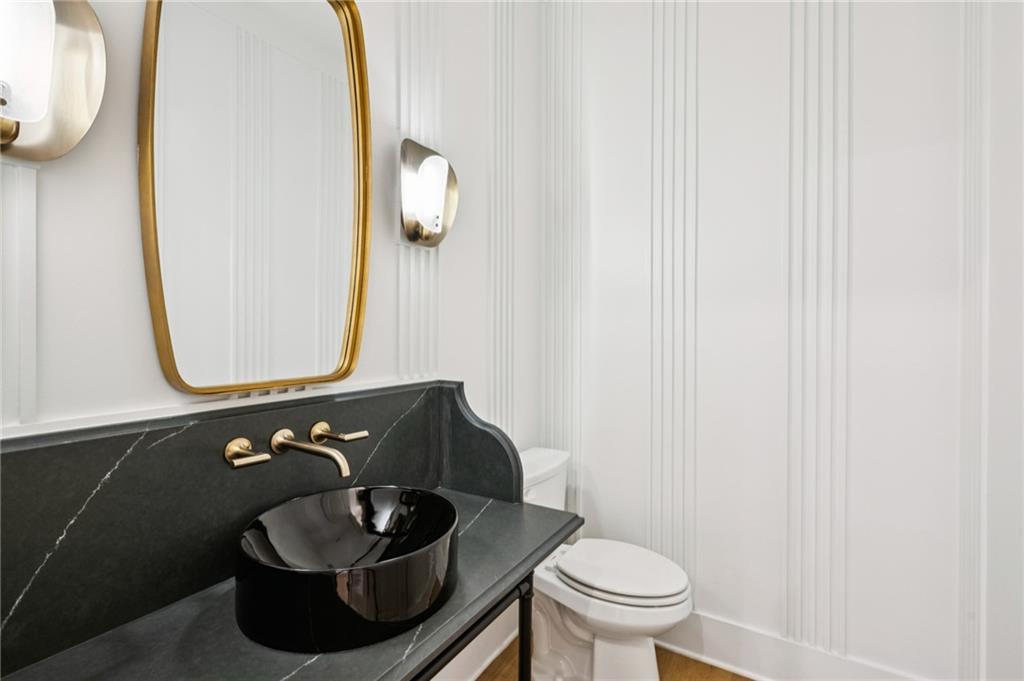 3756 Donaldson Drive Atlanta, GA 30341 - Photo 15 of 38 a bathroom with a toilet and a mirror