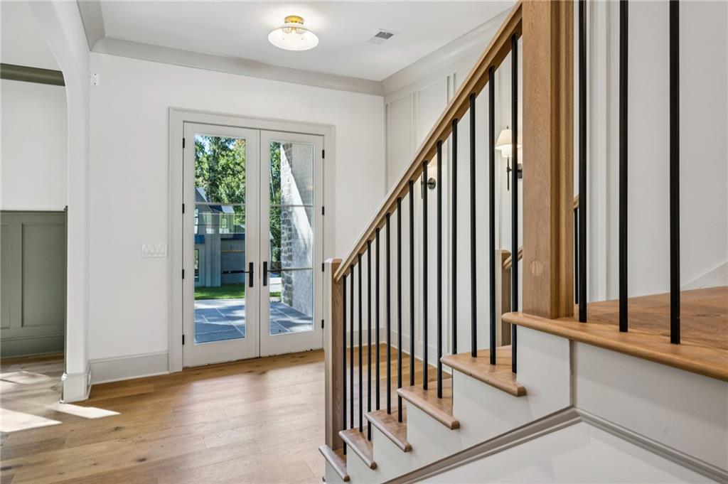 3756 Donaldson Drive Atlanta, GA 30341 - Photo 16 of 38 a view of staircase with wooden floor and a window