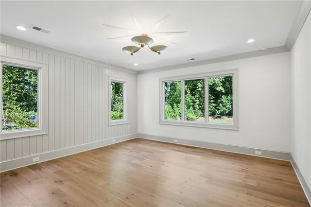 a spacious bathroom with a shower sink and mirror