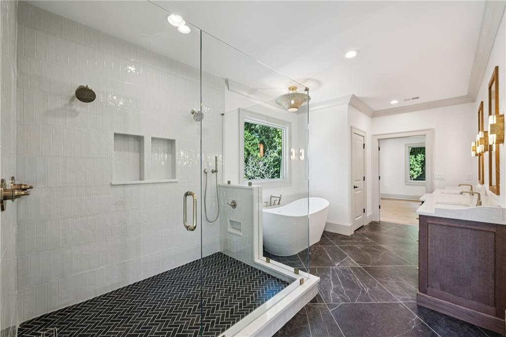 3756 Donaldson Drive Atlanta, GA 30341 - Photo 19 of 38 a spacious bathroom with a bathtub shower sink vanity and toilet