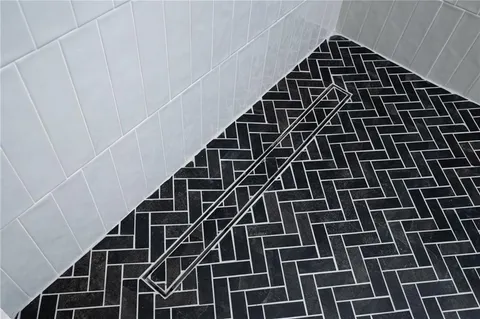 a view of a room with a large window and refrigerator