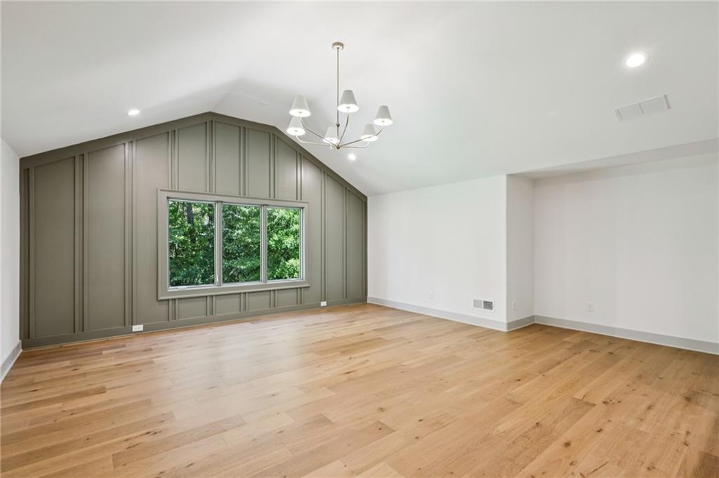 3756 Donaldson Drive Atlanta, GA 30341 - Photo 22 of 38 an empty room with a windows and ceiling fan