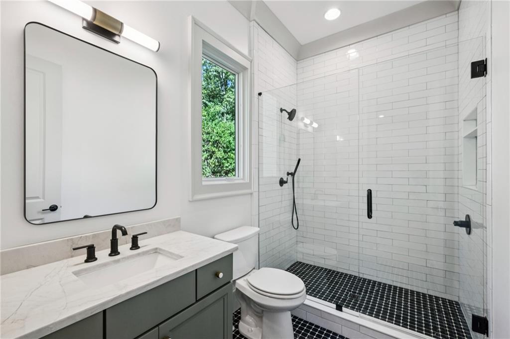 3756 Donaldson Drive Atlanta, GA 30341 - Photo 24 of 38 a bathroom with a sink toilet and shower