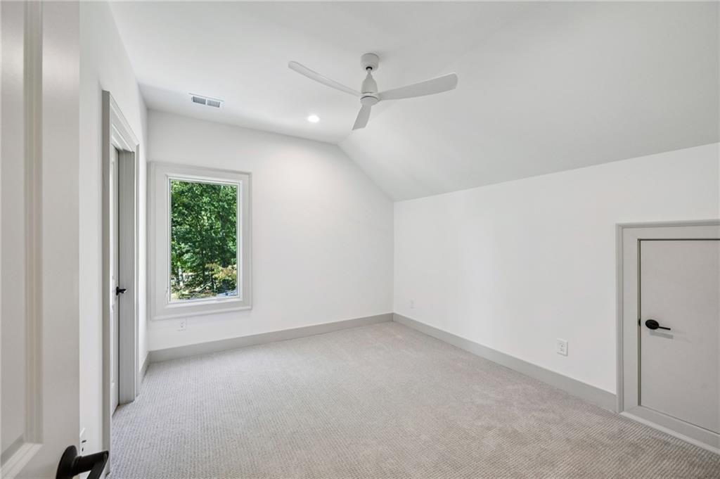 3756 Donaldson Drive Atlanta, GA 30341 - Photo 25 of 38 an empty room with windows and closet