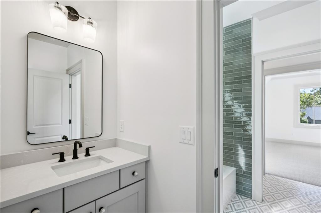 3756 Donaldson Drive Atlanta, GA 30341 - Photo 28 of 38 a bathroom with a sink and a mirror
