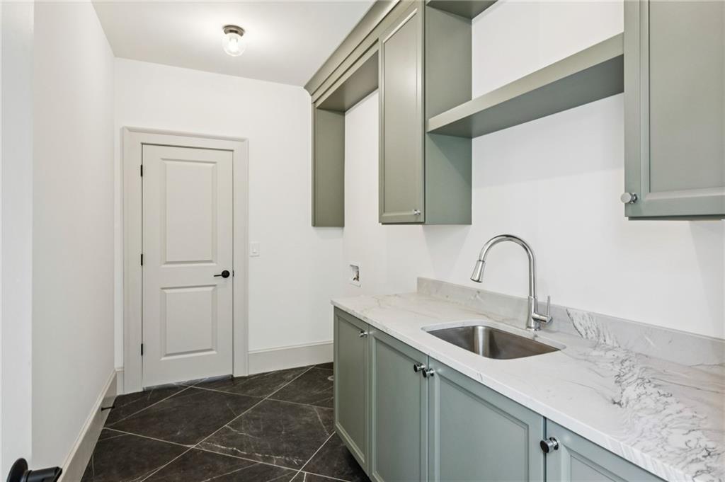 3756 Donaldson Drive Atlanta, GA 30341 - Photo 32 of 38 a kitchen with a sink and cabinets
