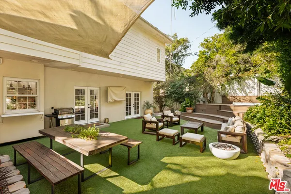 a outdoor living space with furniture and a rug