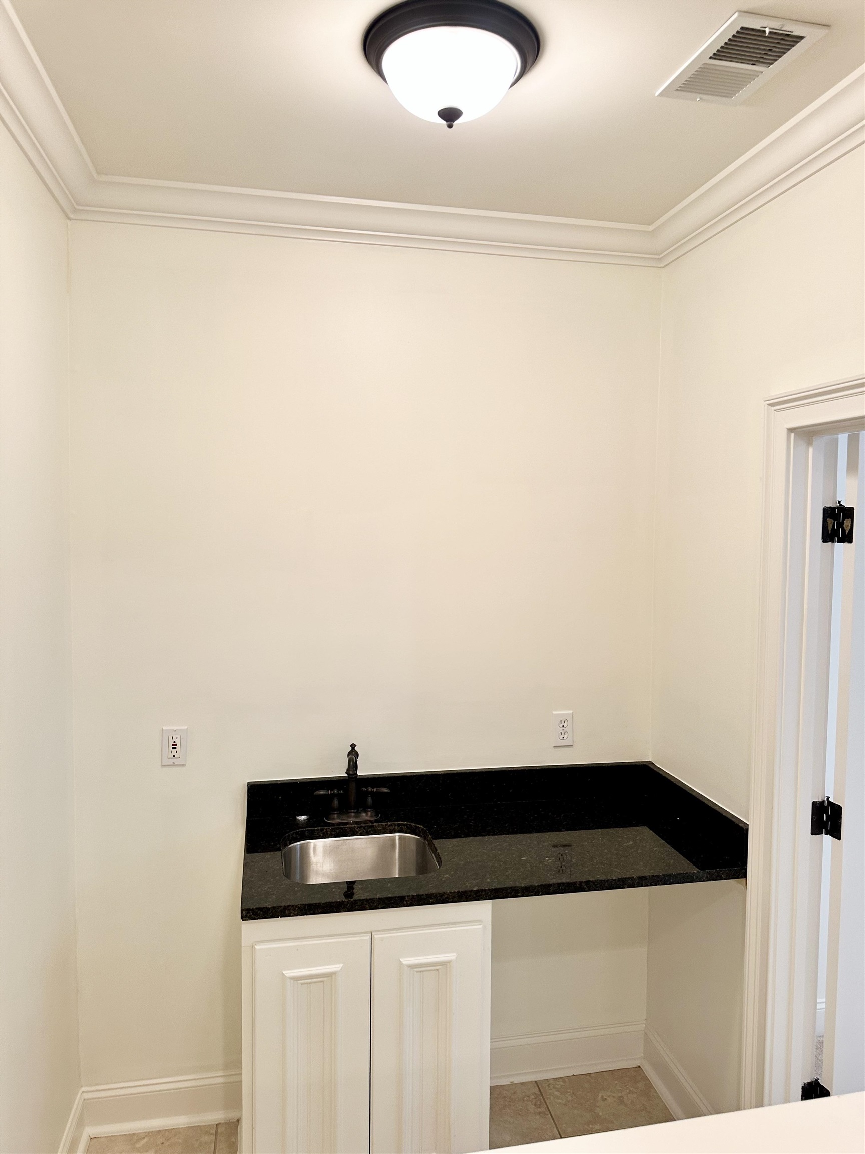 205 Jamerson Farm Road Collierville, TN 38017 - Photo 24 of 33 Interior space featuring ornamental molding, light tile patterned flooring, and sink