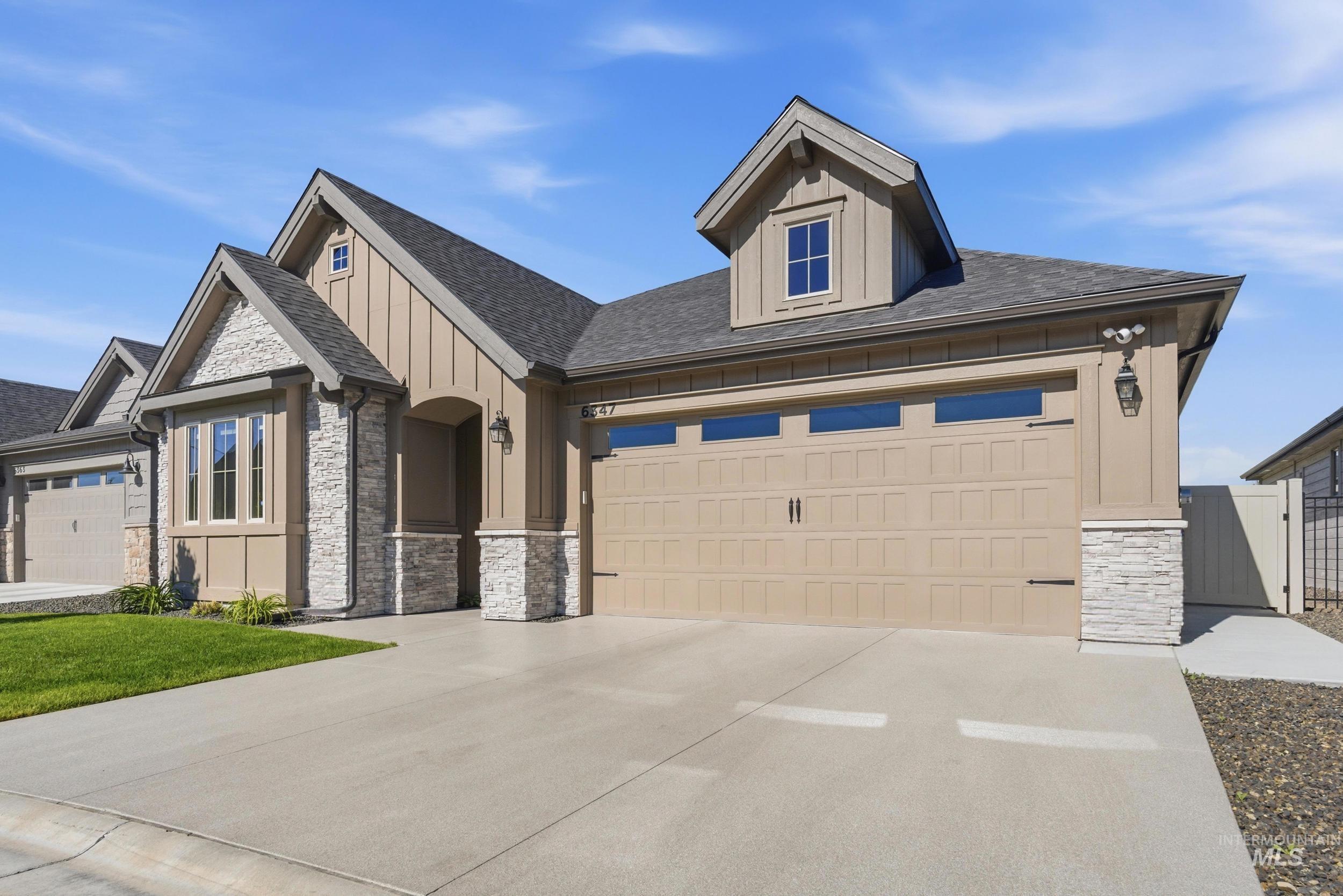 6347 South Utmost Lane Meridian, ID 83642 - Photo 5 of 37 Single-story residence featuring a two-car garage with transom windows