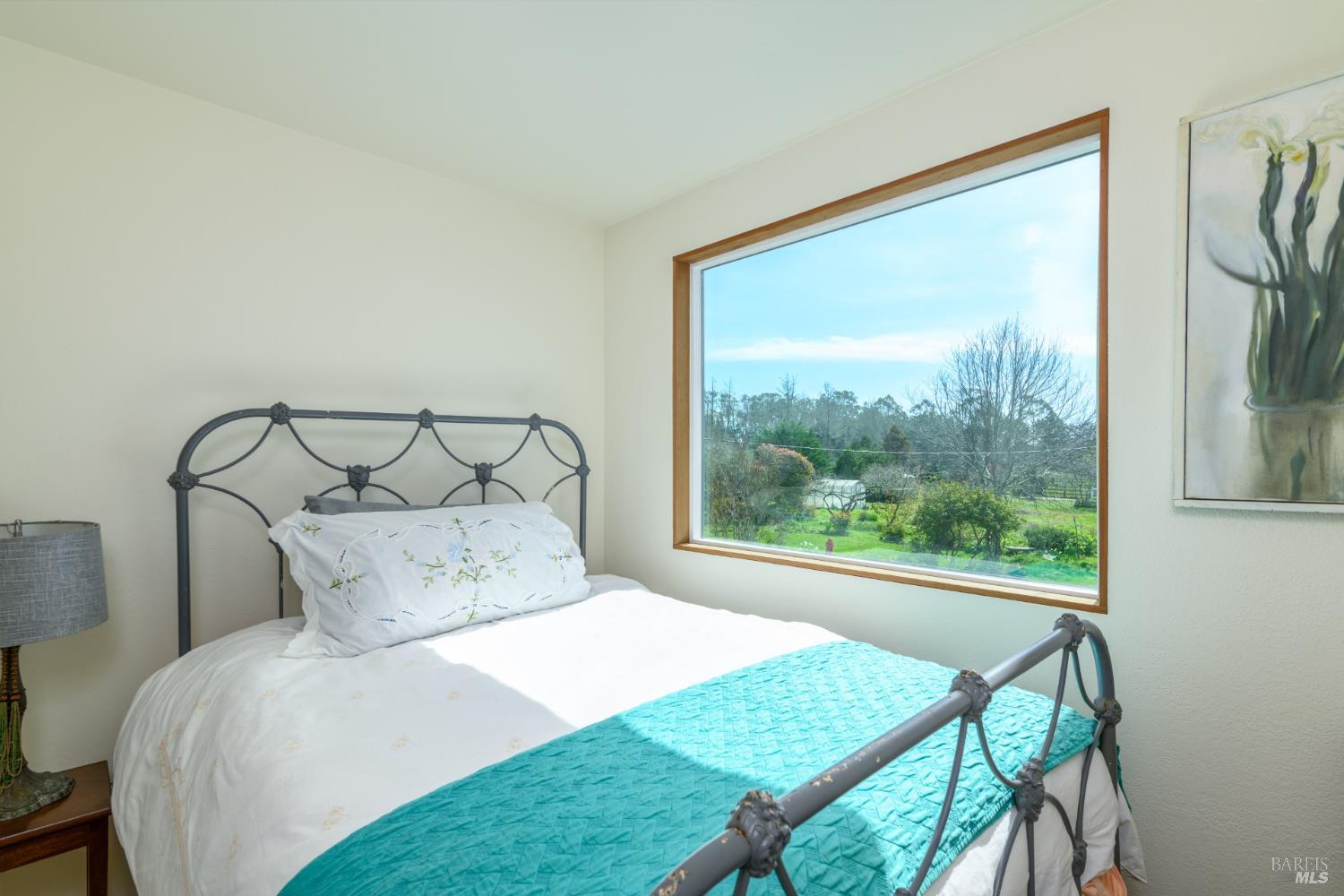 44120 Biaggi Road Manchester, CA 95459 - Photo 15 of 42 a bedroom with a bed a window and a bed