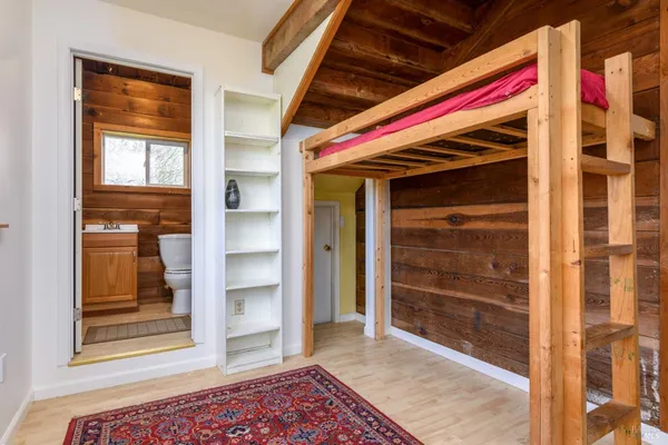 a area with wooden floor and closet