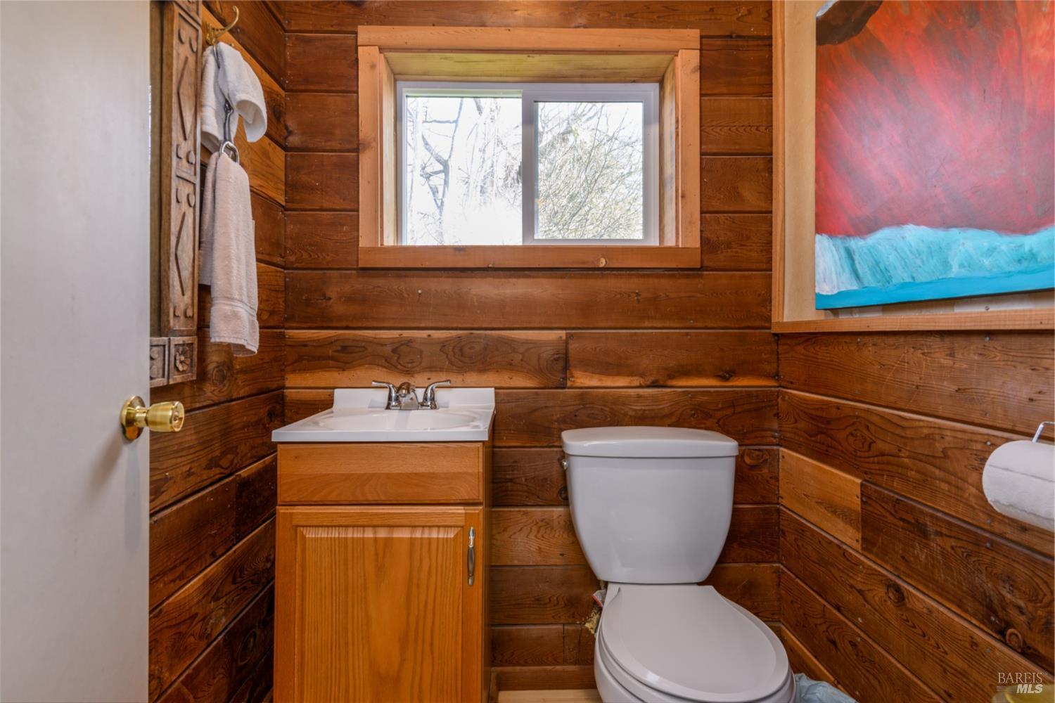 44120 Biaggi Road Manchester, CA 95459 - Photo 18 of 42 a bathroom with a toilet sink and mirror
