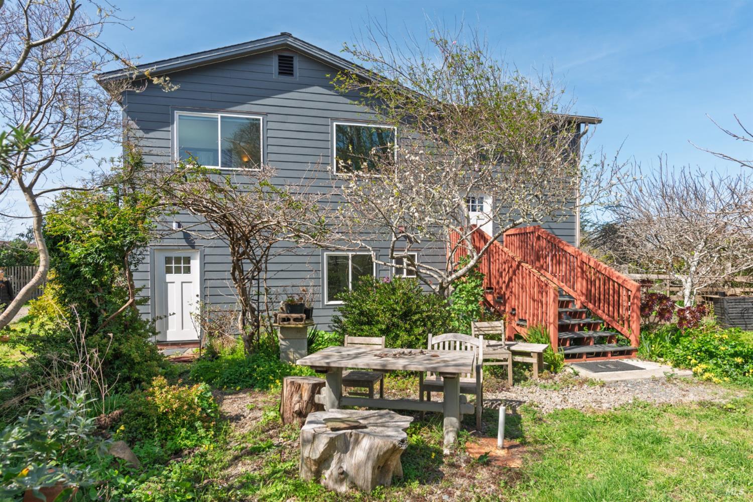 44120 Biaggi Road Manchester, CA 95459 - Photo 21 of 42 a backyard of a house with table and chairs