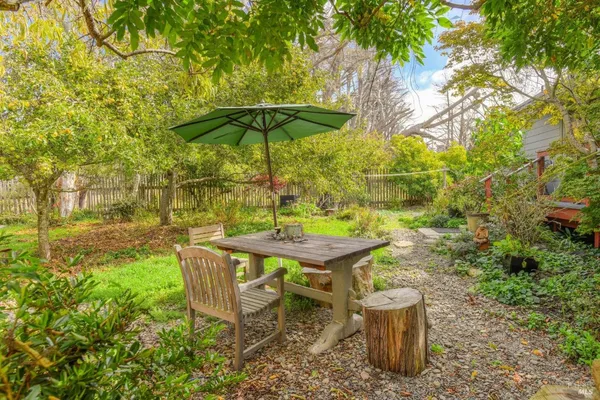 a front view of house with yard and outdoor seating