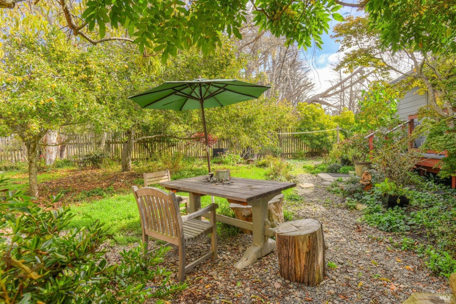 44120 Biaggi Road Manchester, CA 95459 - Photo 22 of 42 a backyard of a house with table and chairs