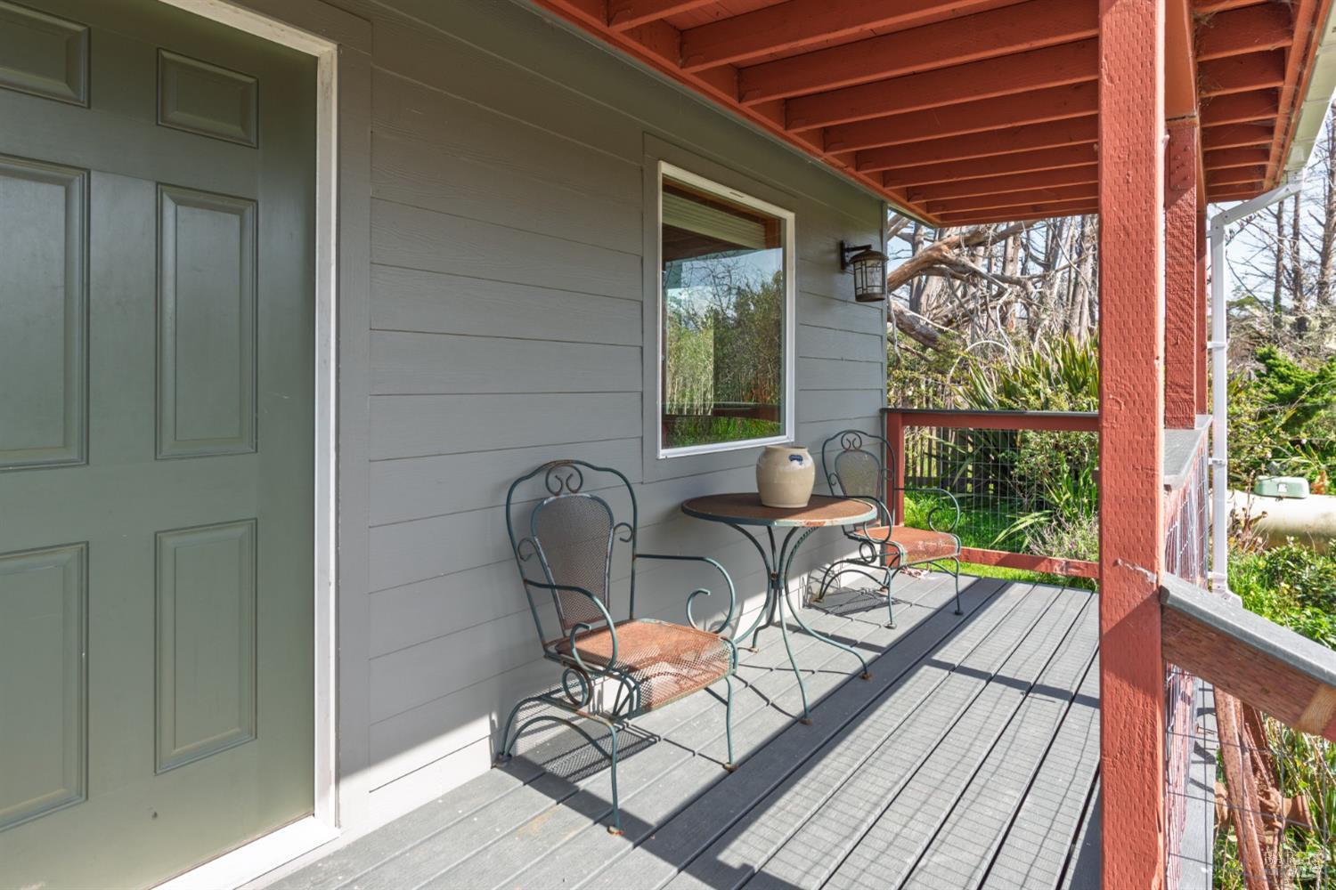 44120 Biaggi Road Manchester, CA 95459 - Photo 27 of 42 a view of a balcony with chairs and wooden floor
