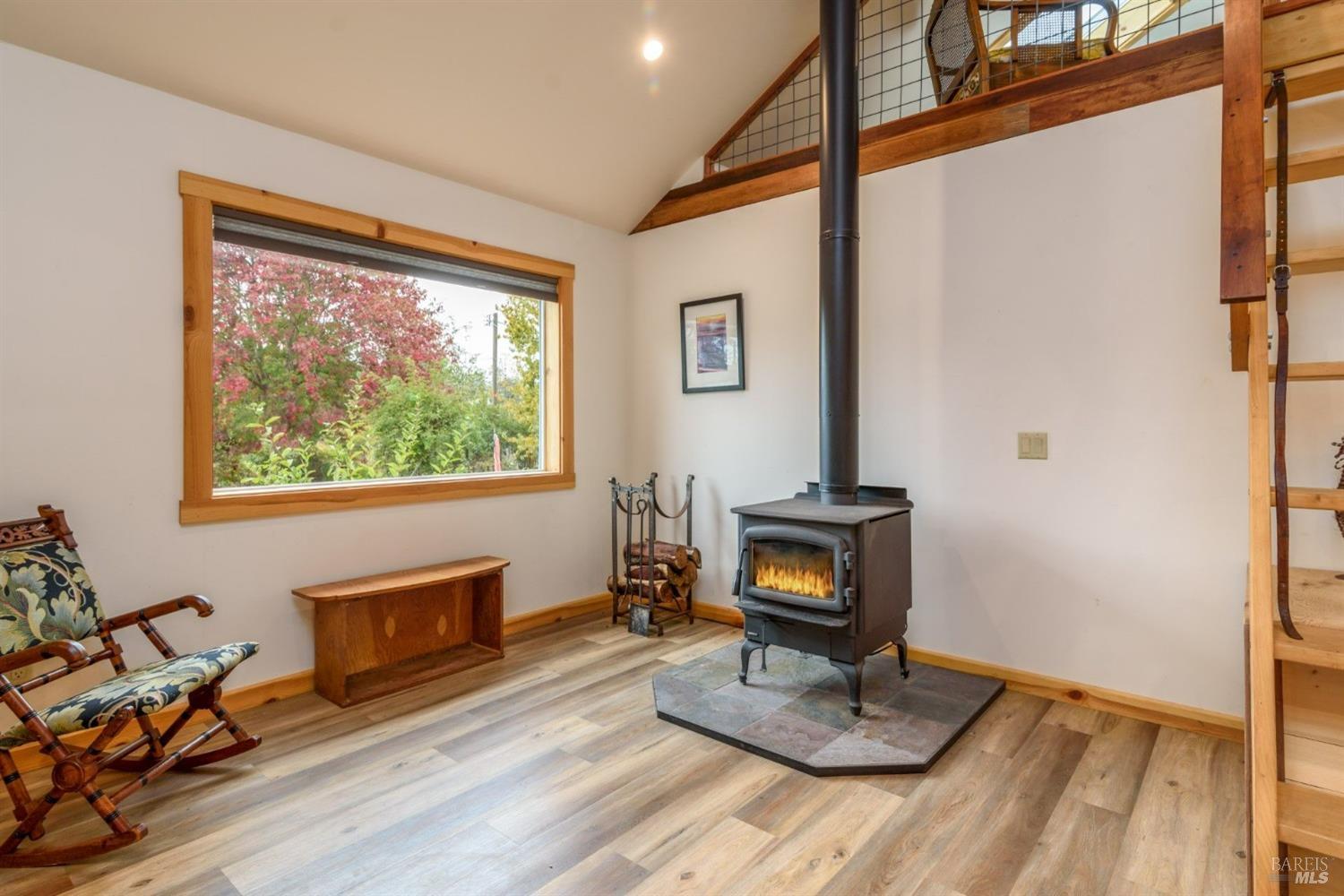 44120 Biaggi Road Manchester, CA 95459 - Photo 28 of 42 a living room with furniture a window and a fireplace