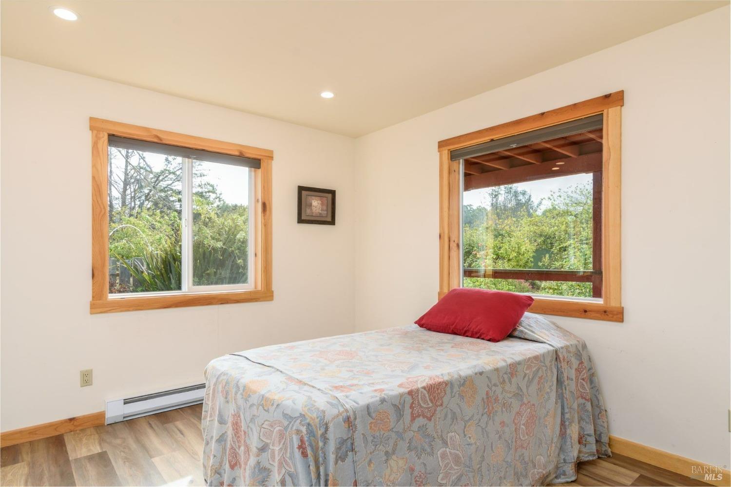 44120 Biaggi Road Manchester, CA 95459 - Photo 32 of 42 a bedroom with a bed and a window