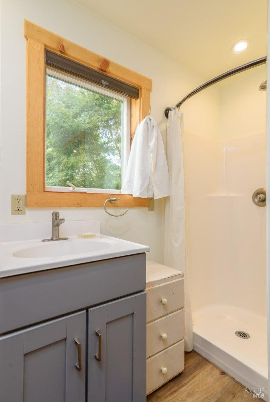 44120 Biaggi Road Manchester, CA 95459 - Photo 35 of 42 a bathroom with a sink and a mirror