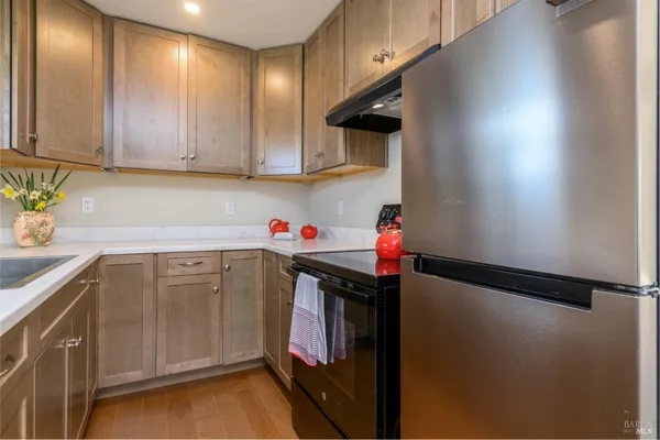 a utility room with cabinets washer and dryer