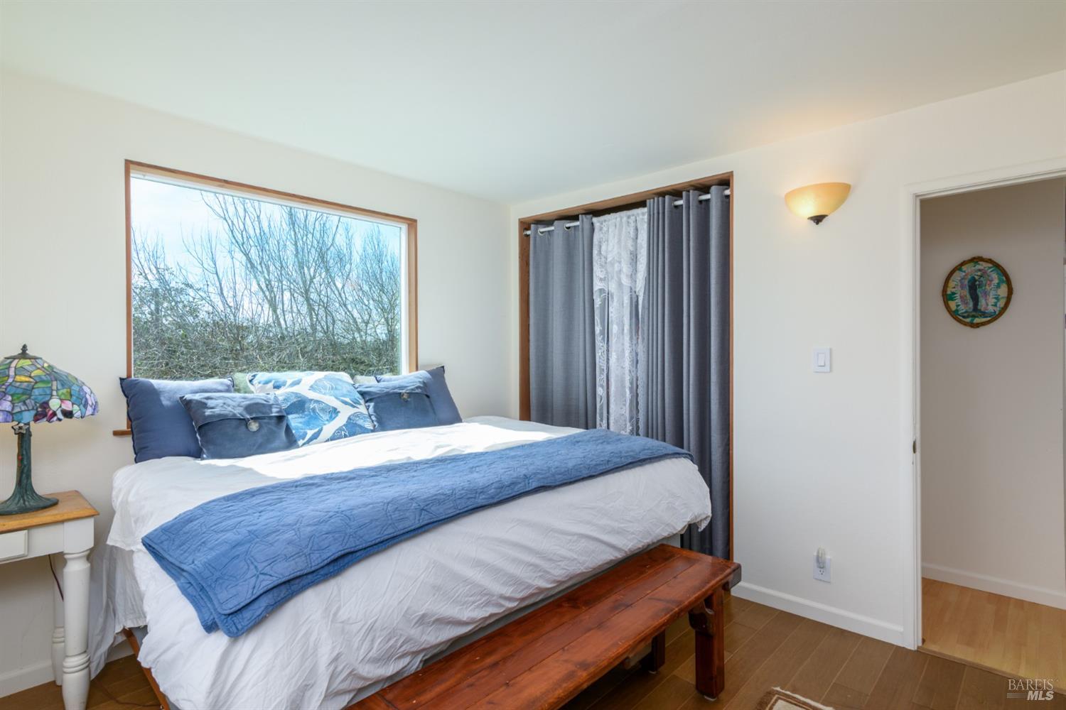 44120 Biaggi Road Manchester, CA 95459 - Photo 9 of 42 a bedroom with a bed and wooden floor