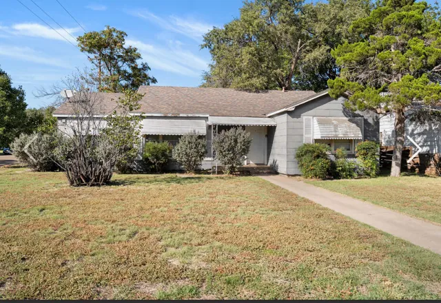 a view of a backyard of the house