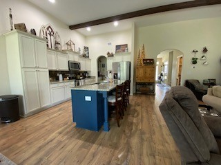 1022 Selous Drive Murfreesboro, TN 37128 - Photo 12 of 29 a kitchen with stainless steel appliances kitchen island granite countertop a refrigerator a stove and a wooden floors
