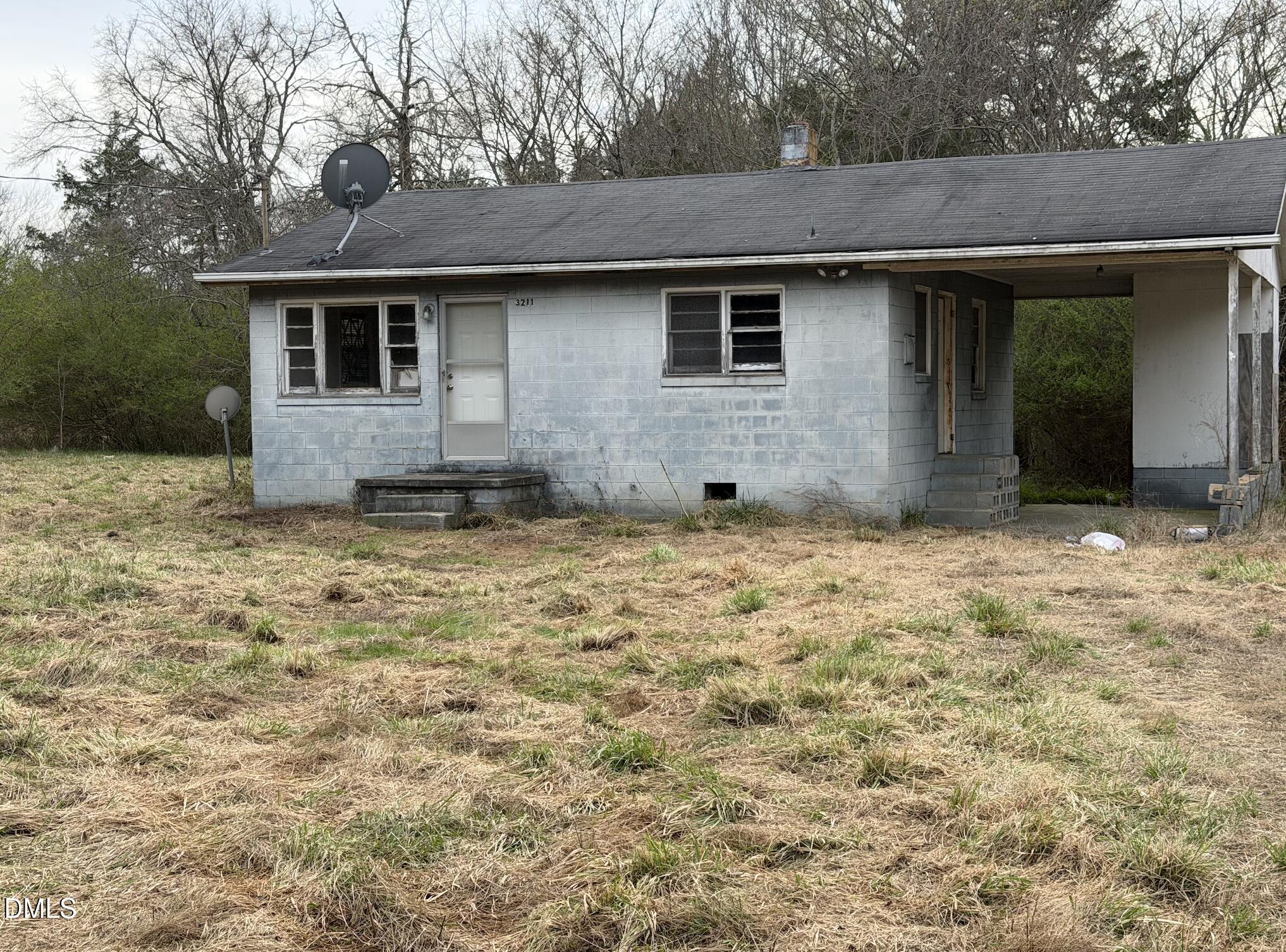 3211 Woodsdale Road Roxboro, NC 27574 - Photo 4 of 5 a view of a house with a yard