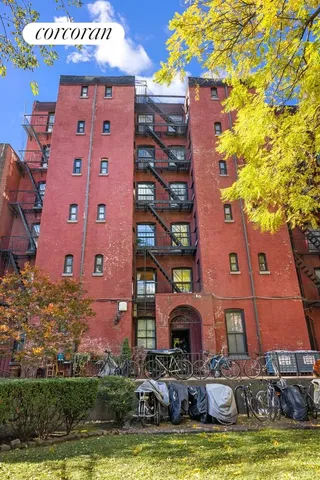 a view of a building with a yard