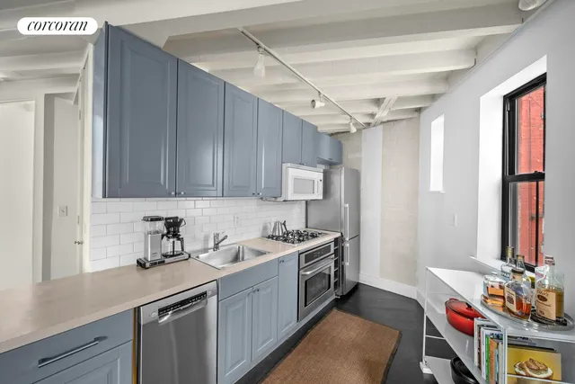 a view of a bedroom with wooden floor and closet