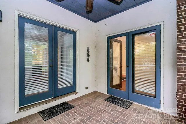 a view of a room that has a large window