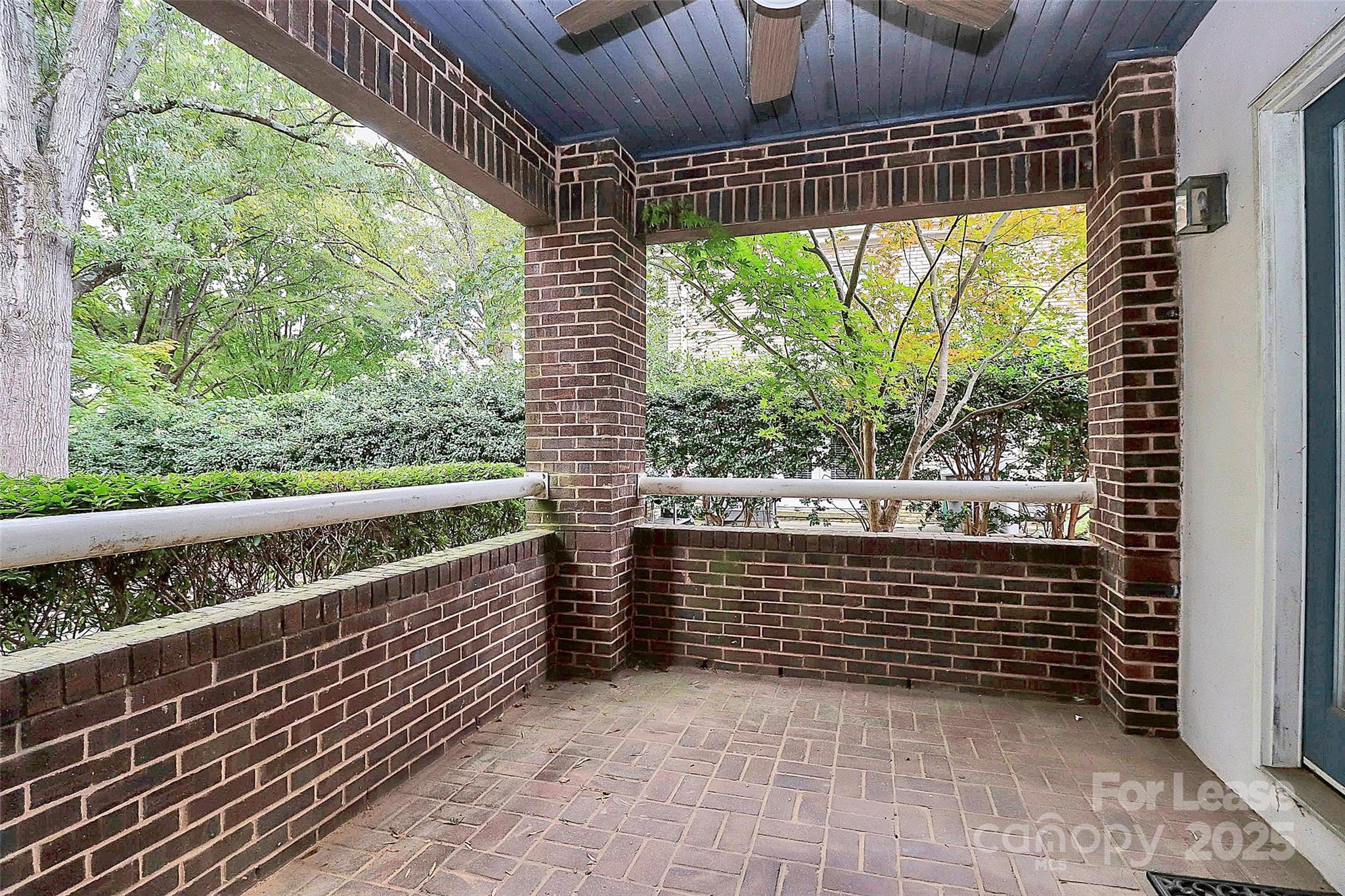 2220 Roswell Avenue, Unit A Charlotte, NC 28207 - Photo 34 of 34 a view of roof deck with wooden floor and fence