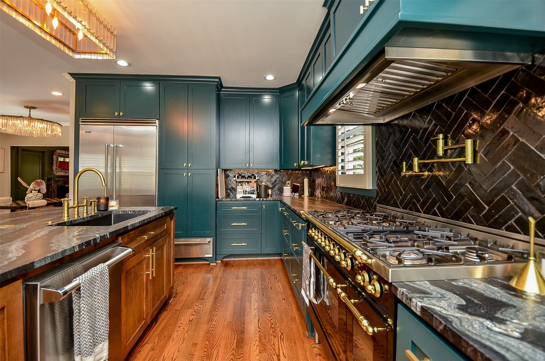 816 West Main Street Houston, TX 77006 - Photo 12 of 48 a kitchen with stainless steel appliances granite countertop a stove a sink and a wooden cabinets
