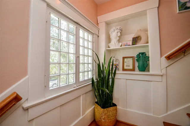 a view of entryway with wooden floor and a potted plant