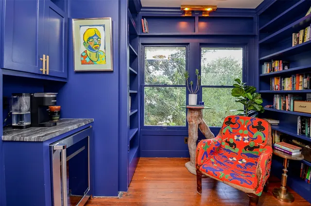 a bedroom with furniture and a window