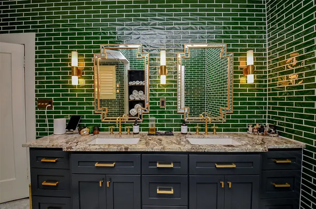 a bathroom with a sink and a large mirror