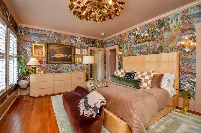 a bed room with a bed and a television