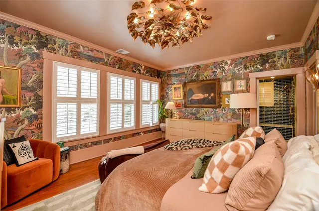 a spacious bedroom with a bed and a couch