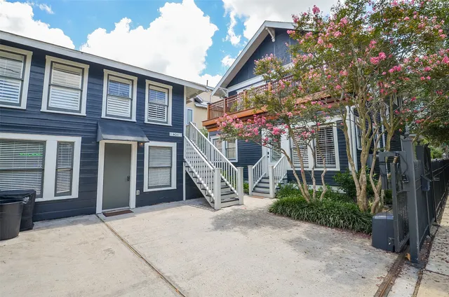 a view of a house with a tree