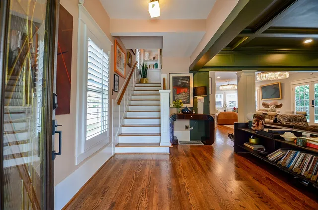 a living room with patio furniture and a large window