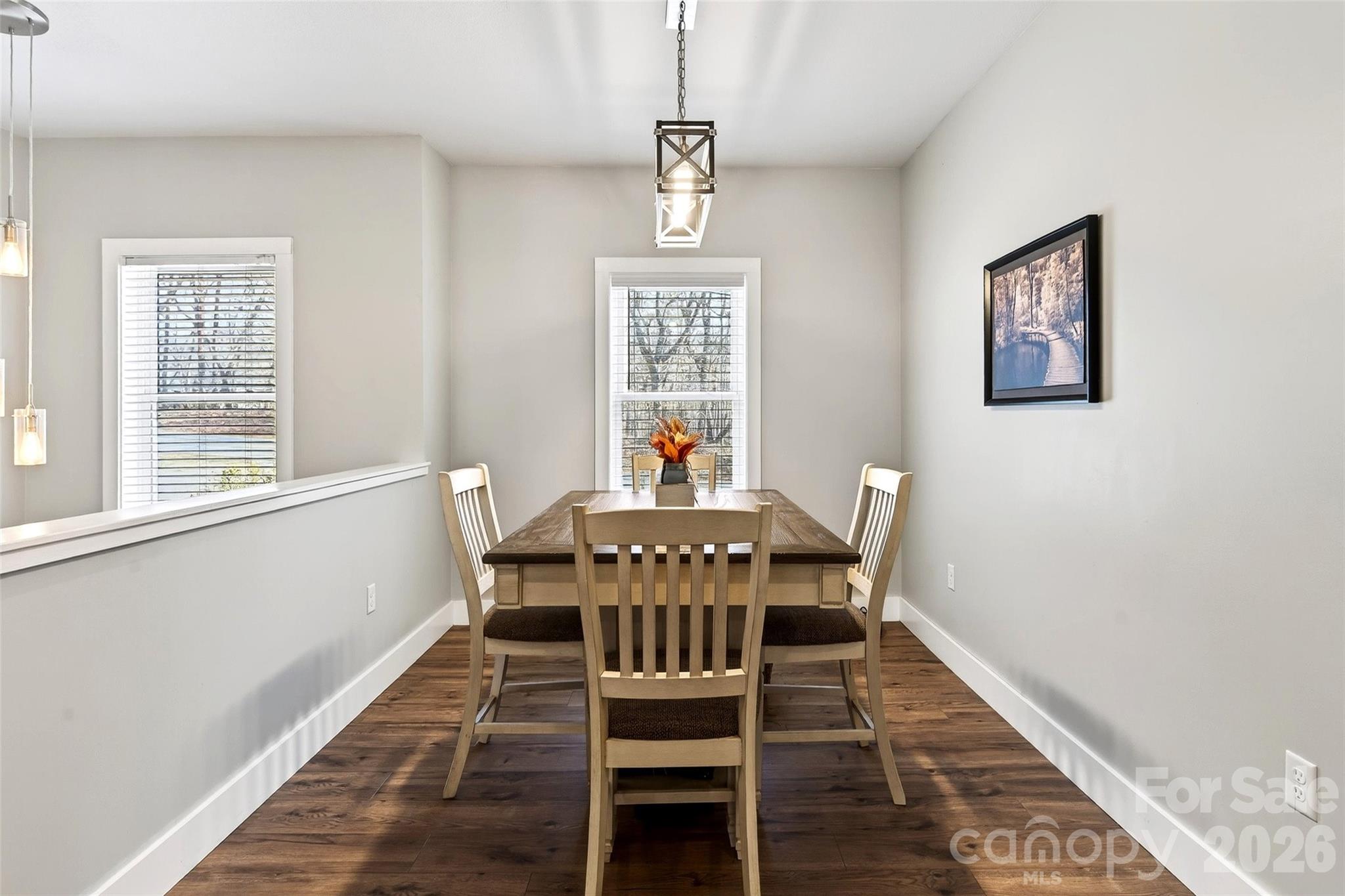 135 Ridge Road Candler, NC 28715 - Photo 10 of 40 a view of a dining room with furniture window and wooden floor