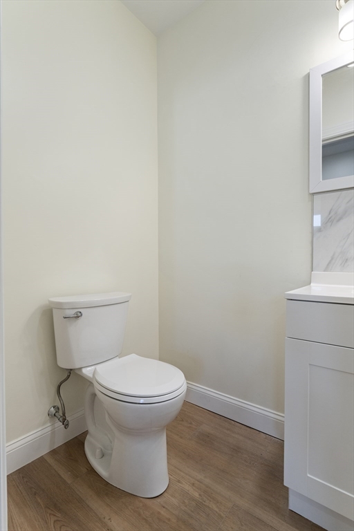 27 Perrin Street, Unit 1 Boston, MA 02119 - Photo 14 of 22 a white toilet sitting next to a white sink