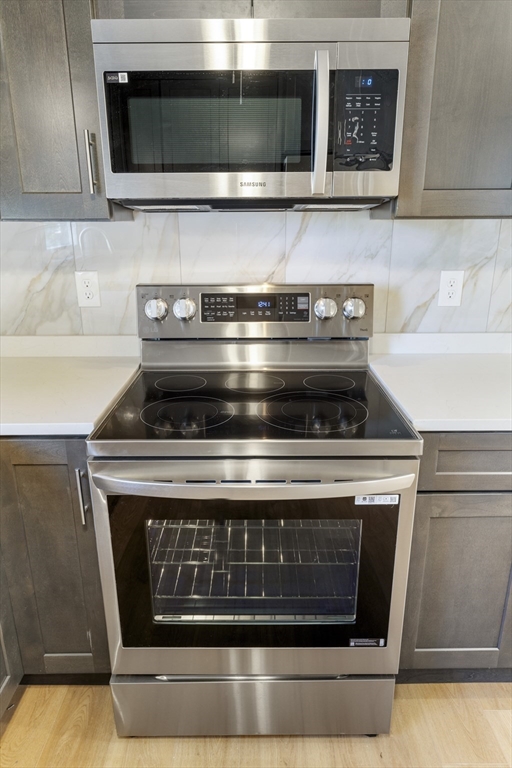 27 Perrin Street, Unit 1 Boston, MA 02119 - Photo 7 of 22 a stove top oven sitting inside of a kitchen