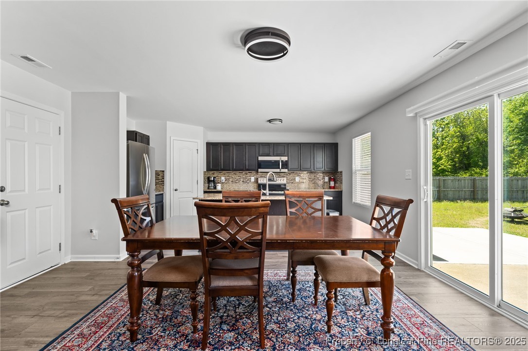 5926 Lowgrass Road Stedman, NC 28391 - Photo 11 of 39 a view of a dining room with furniture window and outside view