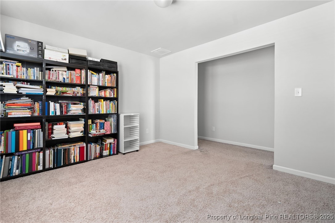 5926 Lowgrass Road Stedman, NC 28391 - Photo 19 of 39 a view of an empty room with shelves