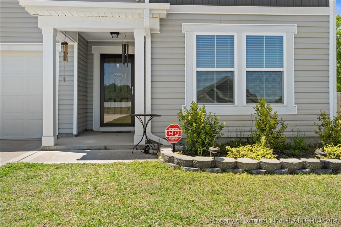 5926 Lowgrass Road Stedman, NC 28391 - Photo 2 of 39 a view of a house with a yard and plants