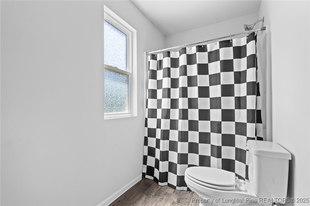 5926 Lowgrass Road Stedman, NC 28391 - Photo 28 of 39 a bathroom with a black and white checkered floor